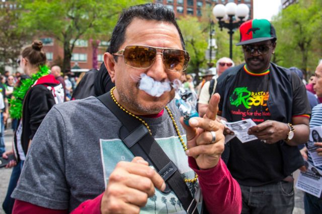 A man smokes at the NYC Cannabis Parade earlier this month
